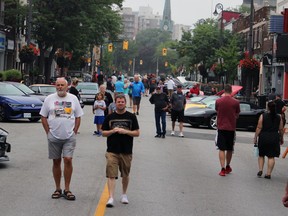 People wander through the Weekend Walkabout event featuring the Sarnia Street Cruisers Sunday in downtown Sarnia.  Terry Bridge/Sarnia Observer/Postmedia Network