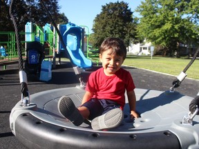 Saula Abad, 2, at the playground in Tecumseh Park.  He and his family just arrived in Sarnia from Brazil.  His mother is a student at Lambton College.  (Paul Morden/The Observer)