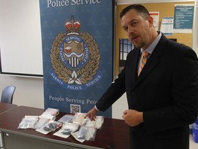 Det.-Sgt. Mike Howell, with the Sarnia police vice unit, points to fentanyl seized Tuesday in the city.