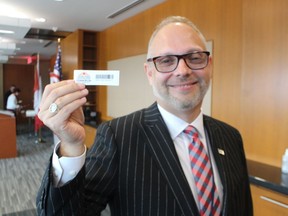 Warren Askew, chief operating officer for the Federal Bridge Corporation, holds a Connexion window tag for the electronic tolls system at the Blue Water Bridge near Sarnia. The system was recently improved in partnership with the Michigan Department of Transportation and the Sault Ste. Marie International Bridge.