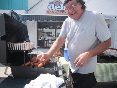 George Hennessey from The Old Tyme Deli and Eatery in Port Rowan was serving sausages and peameal during Bayfest, Sept. 2-4. CHRIS ABBOTT