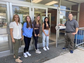 Students, teachers and other educational workers returned to school Tuesday as summer break came to an end.  Simcoe Composite School Principal Jennifer Ippolito, left, and Vice-Principal Matt Malcolm, right, welcomed back students including, from left, Vivian Flemming, Kyleah Sault, and Courtney Baggay, who are all in Grade 10.