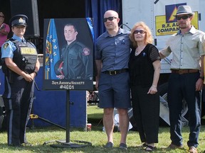 An official park dedication ceremony was held Saturday at Sgt.  Andrew Harnett Memorial Park in Hagersville.  Among those attending during the Summer's End Festival were from left Auxiliary OPP member Chris Dennis, with Jason, Valerie and Chris Harnett.  CHRIS ABBOTT