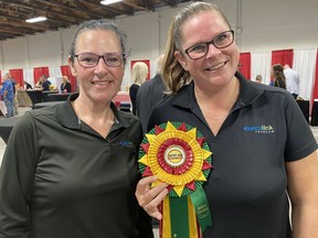 Amy Pond, left, and Jen Grandy, community sales reps for Execulink, were among supporters and sponsors of the Norfolk County Fair & Horse who attended the Partners in Progress reception at the fairgrounds in Simcoe on Wednesday. SIMCOE REFORMER