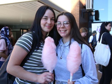 Students Mika Gravelle, left, and Danica Lafleur enjoy cotton candy at the Meet and Greet Carnival at Cambrian College in Sudbury, Ont. on Wednesday September 7, 2022. The event was held as part of Cambrian CollegeÕs Orientation Week activities. The carnival featured entertainers, free food, snacks, popcorn, games and student services. John Lappa/Sudbury Star/Postmedia Network