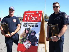 Greater Sudbury firefighters Al Murray, left, and Rob Colton take part in Fill the Boot campaign for Muscular Dystrophy Canada in Sudbury, Ont. on Wednesday September 7, 2022. John Lappa/Sudbury Star/Postmedia Network