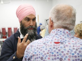Federal NDP Leader Jagmeet Singh chats with Robert Plourde, vice-president of Club d'Age d'Or de la Vallee, during a visit to the club in Greater Sudbury, Ont. on Monday September 12, 2022. Evan Roberts wants the the NDP leader to signal that Canada hasn't become the mercenary cousin of grossly misguided US foreign policy. John Lappa/Sudbury Star/Postmedia Network