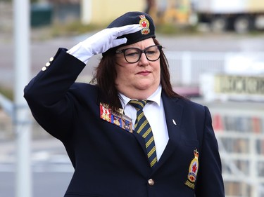Branch 564 president Jennifer Huard salutes during a memorial service for Her Majesty Queen Elizabeth II at Lockerby Legion Branch 564 in Sudbury, Ont. on Monday September 19, 2022. John Lappa/Sudbury Star/Postmedia Network
