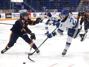 Quentin Musty, right, of the Sudbury Wolves, fires the puck past Connor Punnett, of the Barrie Colts, during OHL exhibition action at the Sudbury Community Arena in Sudbury, Ont. on Tuesday September 20, 2022. John Lappa/Sudbury Star/Postmedia Network