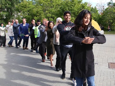 Climate activist Sophia Mathur leads a group in a dance at a Fridays For Future Greater Sudbury rally at Laurentian University in Sudbury, Ont. on Thursday September 22, 2022. Sudbury climate activists took part in the rally to mark the Global Day of Action. The event was hosted by Fridays For Future Greater Sudbury in collaboration with LaurentianÕs Student General Assembly, the Laurentian Environmental Sustainable Committee, CCL Greater Sudbury and Coalition for a Liveable Sudbury. John Lappa/Sudbury Star/Postmedia Network