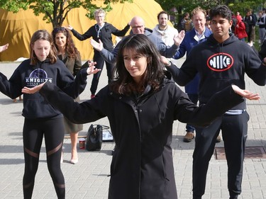 Climate activist Sophia Mathur leads a group in a dance at a Fridays For Future Greater Sudbury rally at Laurentian University in Sudbury, Ont. on Thursday September 22, 2022. Sudbury climate activists took part in the rally to mark the Global Day of Action. The event was hosted by Fridays For Future Greater Sudbury in collaboration with Laurentian's Student General Assembly, the Laurentian Environmental Sustainable Committee, CCL Greater Sudbury and Coalition for a Liveable Sudbury. John Lappa/Sudbury Star/Postmedia Network