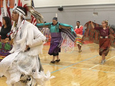 Ramon Maheghan Kataquapit, left, is seen here among the parade of dancers during the 20th-annual Northern College powwow on Sunday. Seen spreading their wings behind him are dancers Ceilidh O'Hearn and Shanel Goulet.

RON GRECH/The Daily Press