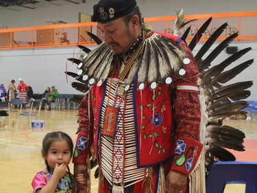 Clarence Trapper, a Cochrane resident originally from Moose Factory, attended the Northern College powwow with his three-year-old grand-daughter Emily. This was the first time Emily took part in a powwow.

RON GRECH/The Daily Press