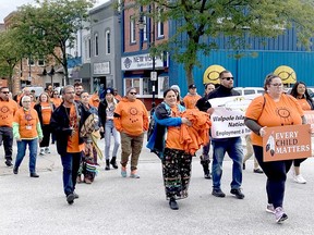 Participants are seen in downtown Wallaceburg taking part in the Healing Walk and Gathering held Thursday ahead of the National Day for Truth and Reconciliation. PHOTO Peter Epp/Postmedia