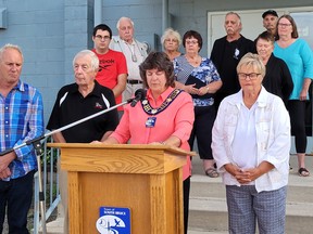 Town of South Bruce Peninsula Mayor Janice Jackson is surrounded by members of council and the Wiarton Propeller Club as she announces at a media conference the club's meeting place is being donated to the municipality to make way for affordable housing. Photo supplied by the Town of South Bruce Peninsula