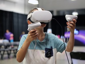 Nathan Dykeman, 8, tries out the "epic roller coaster" virtual reality game at Swerve 2022. The Nuclear Innovation Institute's free futuristic science and technology festival was held over the weekend inside at the Southampton Coliseum. Greg Cowan/The Sun Times