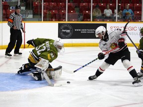 Deni Goure is able to slide the puck under Charlie Robertson's goalstick and into the net to make it 2-0 in the first period as the Owen Sound Attack host the North Bay Battalion on Tuesday, Sept. 20, 2022, inside the Harry Lumley Bayshore Community Cente in Ontario Hockey League preseason action. Greg Cowan/The Sun Times