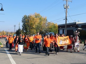 Participants in Whitecourt's Orange Shirt Day moved from Rotary Park to downtown on Friday.