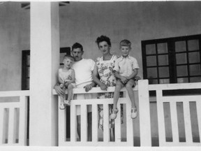 The Maynard family on the balcony of their house with Bob sitting on the rail.
--Millet Museum and Archives
