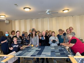 Volunteers at South Shore Church used donated clothing to make quilts for the homeless. They are making 10 quilts for Hope Awaits, a men's shelter in North Bay.