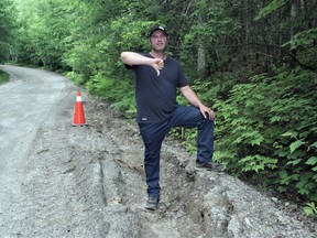 Strong Township mayoral candidate Tim Bryson gives the thumbs down on the condition of South Lake Bernard Road during the early summer.  Bryson says it took more than two months for the municipality to repair the deep ditch that was created alongside the road. Bryson is campaigning on better roads for Strong and is pro-amalgamation.