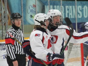 Nate Gravelle celebrates a 2nd period goal with Joshua Currie.