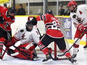 Aedan Girard (25) and Carter Musselman (23) of the Mitchell Hawks fail to find the puck and beat Hanover Barons' netminder Riley McCabe during PJHL North Pollock Division action in Mitchell Oct. 1. The Hawks and Barons - last year's division finalists - battled once again, this time the Barons winning 2-1 in overtime. Mitchell also thrashed Kincardine 7-2 and have a 4-0-1 record five games into the new season.