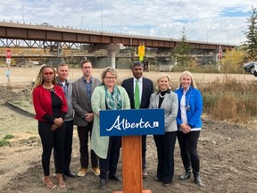 Alberta Transportation Minister Prasad Panda, Fort Saskatchewan-Vegreville MLA Jackie Armstrong-Homeniuk, Fort Saskatchewan Mayor Gale Katchur, and members of city council gathered at the Highway 15 bridge construction site on Monday, Oct. 3, to announce that project will be completed in two weeks. Photo Supplied.