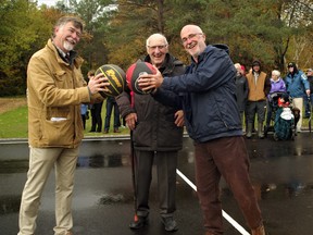 Sundridge Mayor Lyle Hall, left, and Deputy Mayor Shawn Jackson flank former Sundridge mayor Elgin Schneider on the basketball court at Elgin Park. The municipality named the newly completed park after Schneider to recognize his 44 years on town council. Thirty-four of those years were as the reeve and mayor making Schneider one of Ontario's longest-serving municipal politicians.