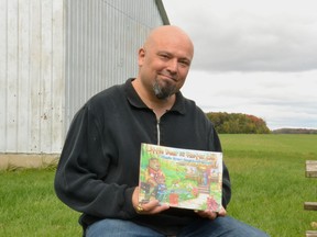 St. Marys area author S.P. Joseph Lyons' children's book, Little Bear in Foster Care, has won First Nation Communities READ's 2022-2023 PMC Indigenous Literature Award. Pictured, Lyons holds his book, which he wrote as a letter to his younger self when he was a child in foster care, on his property located just outside of St. Marys. Galen Simmons/The Beacon Herald/Postmedia Network
