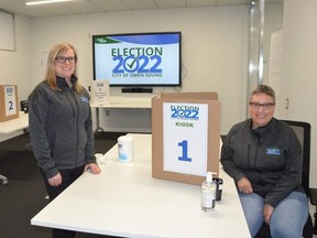 City Clerk Briana Bloomfield, left, and Manager of Legislative Services Kristen Van Alphen at one of the voting kiosks at the Election Help Centre at Owen Sound city hall on Tuesday, October 11, 2022.