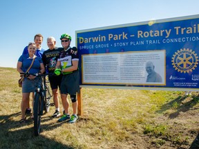 From left to right, Coun. Erin Stevenson, Coun. Dave Oldham, Darwin Park, and Coun. Stuart Houston celebrate the dedication of a section of Rotary Trail to Park on Sunday, Oct. 2, 2022. Photo courtesy of the City of Spruce Grove.
