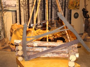 IMG_2794 – Bucksaw 82.1263, seen in a 2015 Peace River Museum, Archives and Mackenzie Centre forestry exhibit, was handmade by Hans Hufnagel. He used the hand-powered frame saw between 1925 and 1941. The bucksaw, with a history going way back, is used with either a sawbuck, or sawhorse, to cut logs, posts, or firewood to length – bucking. Early frames were hardwood, either H-or C-shaped to hold removable, coarse-toothed crosscut blade. Its size, weight, design, and portability remain popular in the bush.