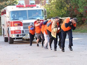 The Brockville Fire Department team gets things moving at the 2022 edition of the YMCA Fire Truck Pull on Saturday, Oct. 15. 
Tim Ruhnke/Postmedia Network