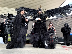 Sarah Steele took home second prize in the masters division of the costume contest during Crowfest on Saturday in Chatham's Tecumseh Park. She is seen here receiving her prize from costume contest organizer Linda Creswick. Ellwood Shreve/Postmedia