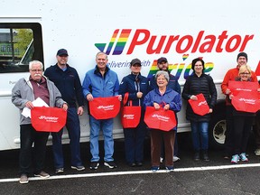 Photo by KEVIN McSHEFFREY
On Oct. 15, Purolator staff from Sudbury and Elliot Lake Emergency Food Bank volunteers delivered 1,500 red bags to homes in Elliot Lake. They ask residents to fill the red bags with non-perishable food.