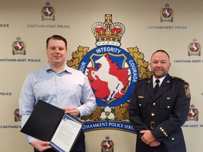 John Maunula, left, a Chatham-Kent emergency communications operator, and his colleague, Victoria Labadie, absent from the photo, were recognized for their assistance of a suicidal man this past summer. Also shown is deputy Chief Kirk Earley. (Trevor Terfloth/The Daily News)