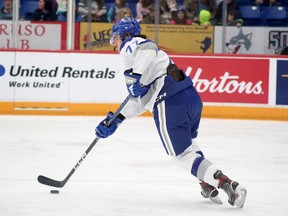 Sudbury Wolves defenceman Nolan Collins carries the puck during OHL action against the Barrie Colts at Sudbury Community Arena on Friday, October 14, 2022.