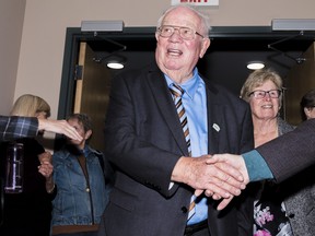 Quinte West Mayor Jim Harrison shakes hands as she arrives in the city's council chambers after being elected to his third term as mayor late Monday night. ALEX FILIPE