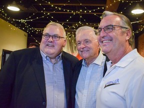 St. Thomas Mayor Joe Preston, left, and city councilors Jim Herbert, middle, and Jeff Kohler celebrate their victories at St. Thomas Roadhouse Bar and Grill on Talbot Street.  Preston won the mayoral seat in Monday's municipal election, defeating former two-term mayor Heather Jackson by more than 2,600 votes in a three-candidate race.  (Calvi Leon/The London Free Press)