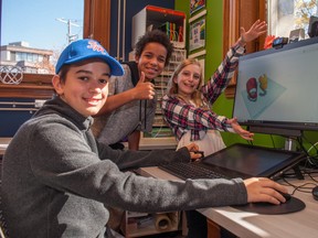 Gavin Heffer-Bodrog (left), 12, Jeremiah Carter, 11, and Madeline Heffer-Bodrog, 10, were using Tinkercad, a 3D modelling program, at the Stratford Public Library’s MakerSpace on Saturday. Chris MontaniniStratford Beacon Herald