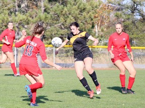 Grace Cranston, centre, plays a bouncing ball during OCAA women's soccer action against the Redeemer Royals on Saturday, October 22, 2022.