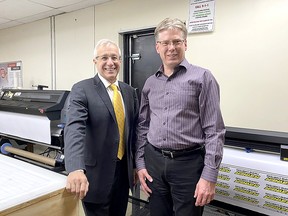David Dawson (owner), owner of Instant Print & Promo in Chatham, gave  Vic Fedeli, Ontario Minister of Economic Development, Job Creation and Trade, a tour of his business on Oct. 18. Contributed