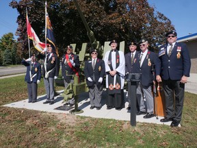 Royal Canadian Legion Branch 153 members Dorothy Longridge, Claude Bolduc CD, Tom Brown CD, Dianne Hodges, Paul Robinson CD, Don Burton, Darrell Ball (Royal Highland Fusiliers of Canada), and Brian Harris (Provincial Poppy Chairman) recently participated in the official dedication ceremony of the memorial anti-aircraft gun in front of the Tillsonburg Legion. CHRIS ABBOTT