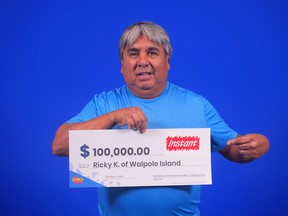 Ricky Kewayosh of Walpole Island has won $100,000 playing an Ontario Lottery and Gaming Corporation game called Instant 5X The Cash. OLG photo