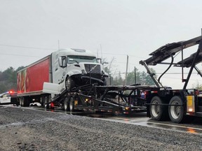 A transport rear-ended another truck hauling an empty car trailer Wednesday morning near Espanola.