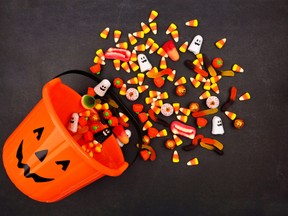 Halloween Jack o Lantern pail, top view with spilling candy