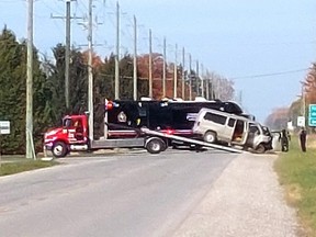A passenger van was pulled from a deep ditch at intersection of Fairview Line and Kent Bridge Road Sunday. Police had the roadway closed off until around 1 p.m. as they investigated the crash that was called in around 7 a.m. (Ellwood Shreve/Chatham Daily News)