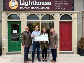 Lighthouse Money Management donation. (L-R): Dan Stringer (Gateway), Glen Steinson (Lighthouse), Gwen Devereaux and Nancy Simpson (both Gateway). Submitted