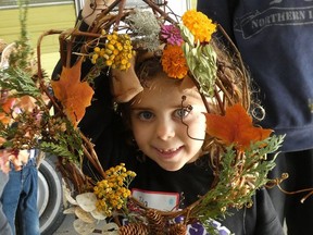 Isla Saxton shows off her colourful fall wreath during a Ripley and District Horticultural Society For Our Youth club meeting in October. Submitted photo.